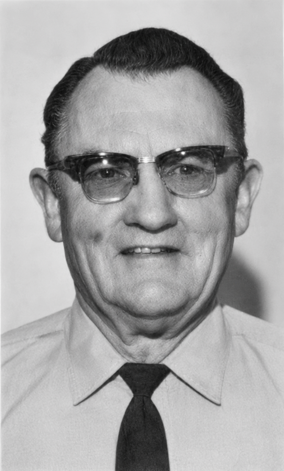 Black and white portrait of William &ldquo;Mike&rdquo; Brock in uniform, a star badge on his chest